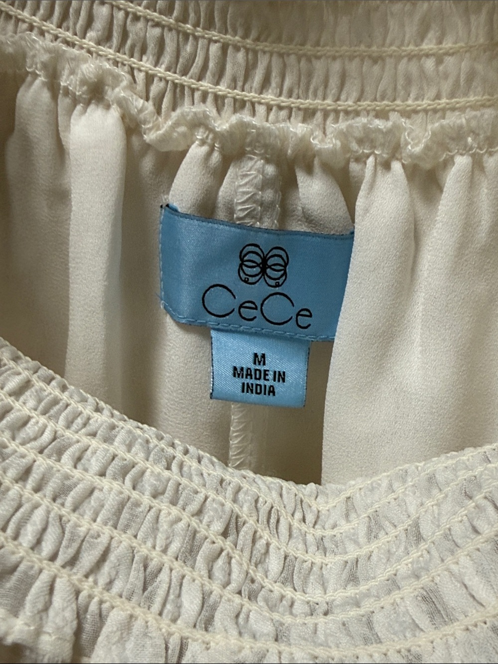 CeCe Ivory Smocked Ruffle Neck Blouse with Tiered Sleeve Ruffles - Picture 5 of 7